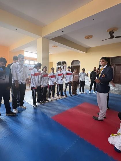 Addressing a group of young and senior athletes at an event. I believe in sharing my experience to motivate the next generation of champions.