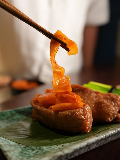 This Open Inari Zushi, topped with sweet simmered vegetables, was a highlight of our seasonal Sakura Menu. It is a light yet flavorful dish that is as visually stunning as it is delicious.