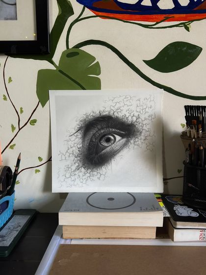 An abstract eye sketch I did, exploring textures beyond pure realism. The graphite strands seem to grow out from the eye, creating a surreal effect.
