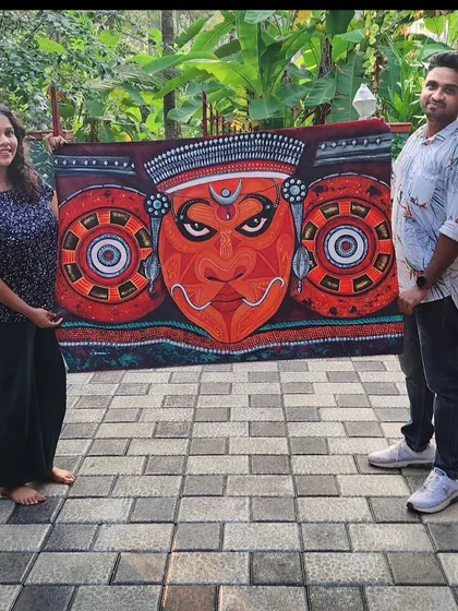 Seeing my art in its new home is the best feeling. Here I am with a happy friend who commissioned a Theyyam painting for his housewarming. Your support helps my small art business grow. 🥰
