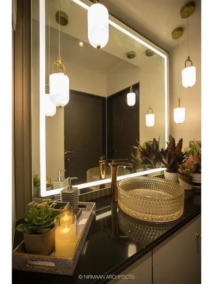 The wash basin area in the Duplex Project, with its warm lighting and carefully chosen accessories. We design every corner of the home to be a beautiful experience.