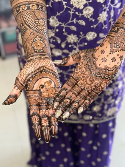 A close-up of the palm featuring a portrait of the bride with her grandmother. This is a perfect example of how mehendi can be a form of personal storytelling.