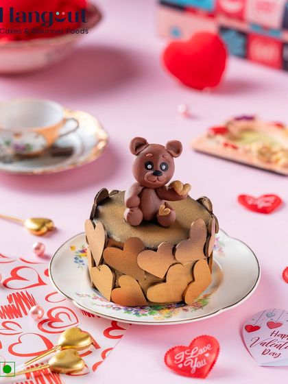 Our signature Dutch Truffle cake gets a Valentine's makeover with chocolate hearts and an edible chocolate teddy bear. It's a rich and romantic treat for your special someone.