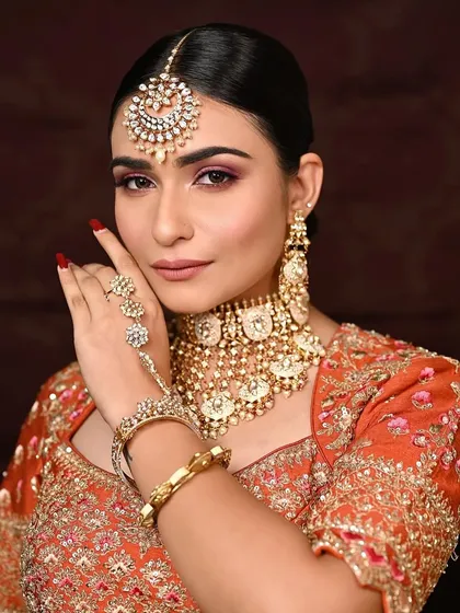 Highlighting the hand jewelry and the perfectly manicured nails, which are an important part of the overall bridal look.