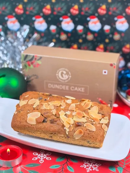 Get into the festive spirit with our classic Dundee Cake, a Christmas specialty. This traditional fruit cake is packed with flavor and topped with almonds, making it a perfect holiday gift or treat for your family gatherings.
