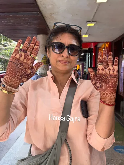 A happy mother showing her full-hand mehendi. It was a pleasure creating these memories and seeing her joy.