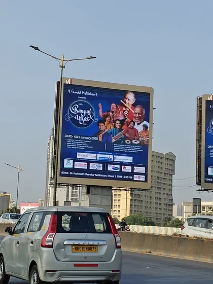 More billboards for the Bansuri Utsav lining the highway, building excitement for this grand music festival.