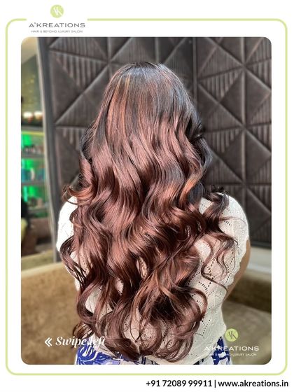This client's transformation is a testament to our skill. We added rich, warm highlights and finished with glamorous curls for a complete style refresh.