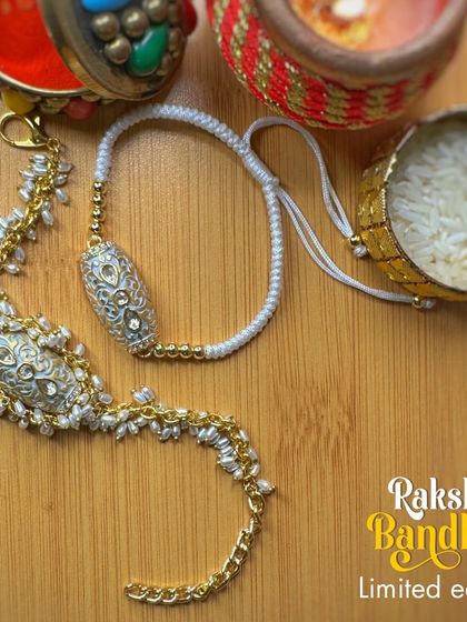 Another beautiful Rakhi and Lumka set for "HIM" & "HER". This one features silver-plated details with delicate pearl work, a timeless and elegant choice for celebrating the bond of family.