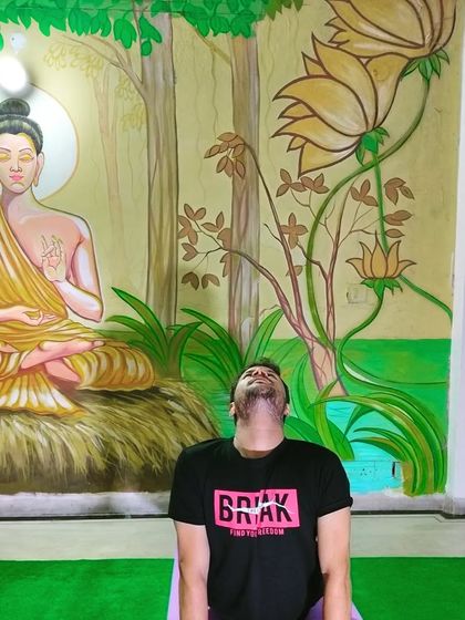 A preparatory neck and shoulder stretch, which is an important part of warming up for deeper backbends like Ustrasana, or Camel Pose.