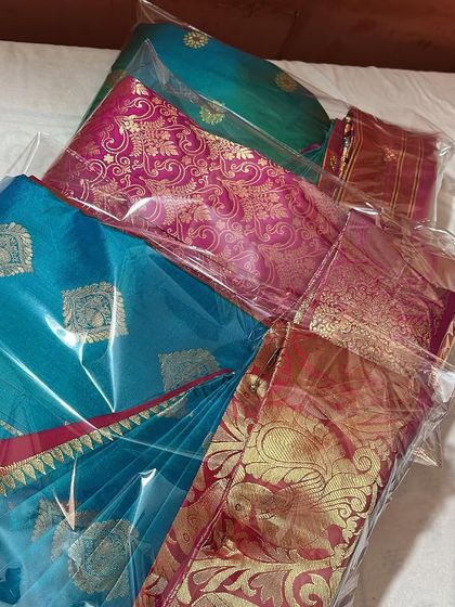 A stack of packed sarees, ready for delivery. This is the final step in my service.