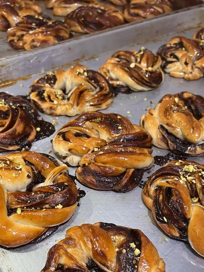 A still shot of my chocolate and pistachio braided pastries. These are a wonderful addition to any holiday breakfast spread or a festive hamper.