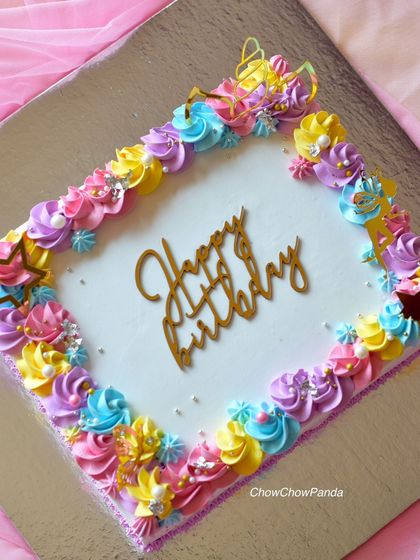 A unicorn-themed sheet cake, which is great for larger parties. I decorated the border with colourful unicorn-palette buttercream swirls, stars, and a unicorn horn.