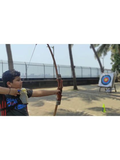 A student takes aim at the balloon-covered target, a fun variation we use in training.