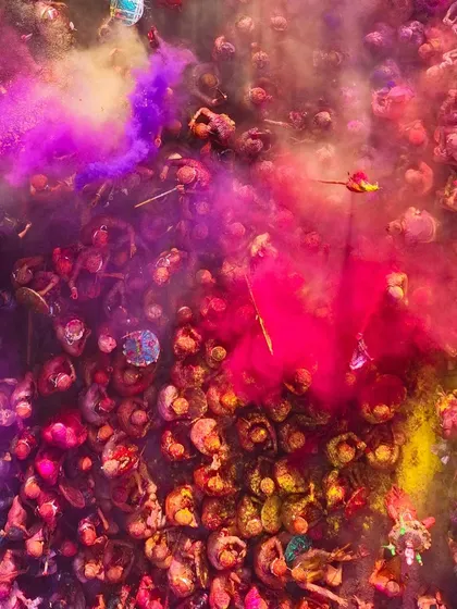 An explosion of pink and red gulal. The energy is electric, and my goal is to translate that feeling into a single, powerful image.