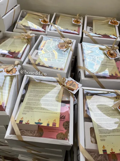 A behind-the-scenes look at the assembly of gift hampers, each containing a personalized letter, showing the care we take with every single order.