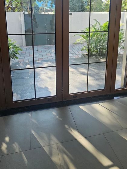A view from the inside looking out through our Georgian bar doors. The design adds a layer of sophistication to the entrance while framing the outdoor view.