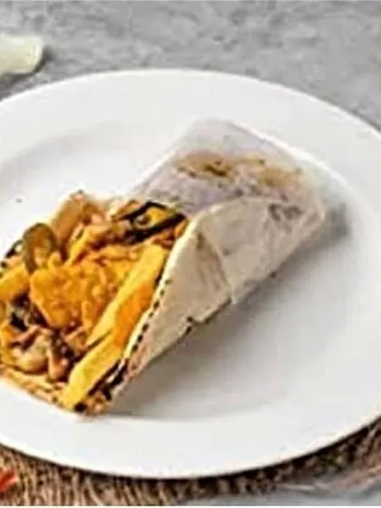 Another look at the Mexican fusion shawarma, this time showing the combination of jalapeños and french fries packed inside the roll for extra texture and flavor.