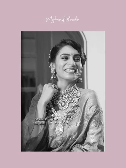 A joyful black and white shot where the bride's smile shines as brightly as her jewelry. This captures the feeling of confidence and happiness that comes with a perfectly styled look.