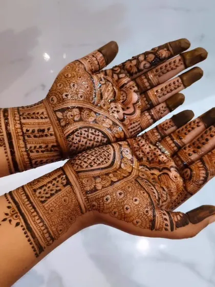 A classic and intricate bridal design with peacocks and detailed check patterns. This is a timeless look that is always in demand for weddings.