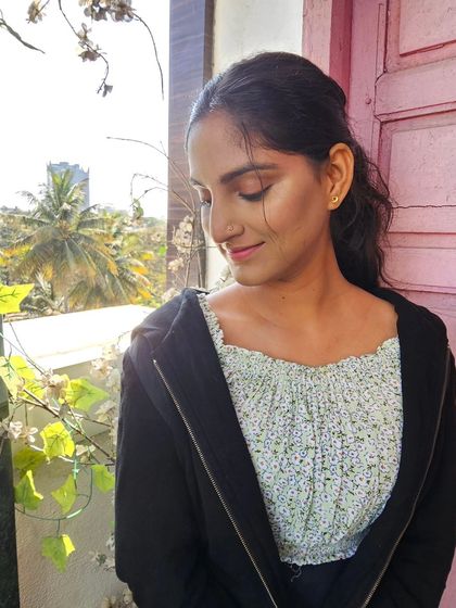 A candid shot from my water-resistant makeup practice. The natural light helps me see how the makeup looks outside of the studio, ensuring it's perfect in any environment.