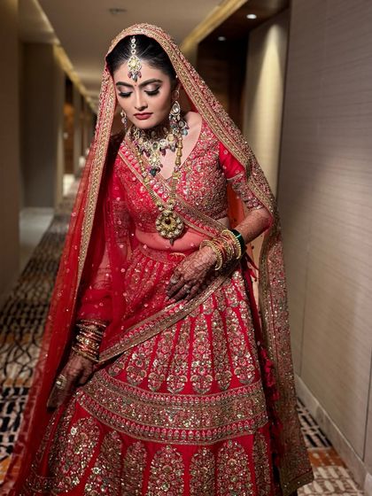 A final look at my stunning bride in her red Sabyasachi lehenga. This look is a testament to my belief in creating makeup that feels like magic and lasts a lifetime.