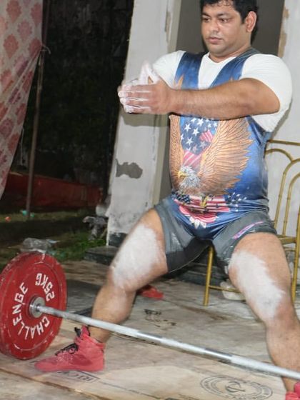 Chalking up for a deadlift at the Delhi state championship. Preparation is mental as much as it is physical.