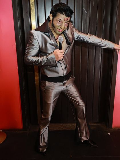 Channeling my inner Elvis Presley, with a zombie twist for Halloween. I enjoy embodying famous personalities and giving them a unique spin.