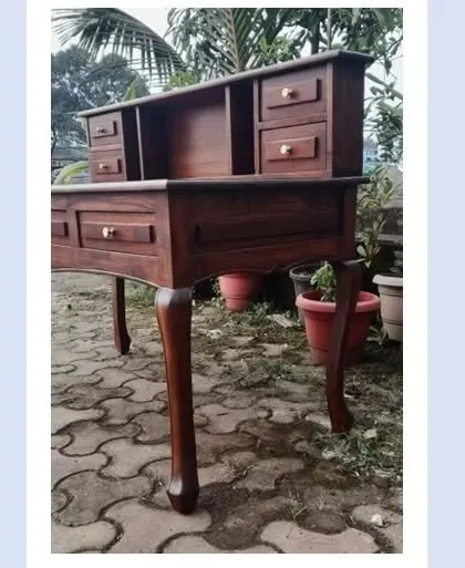A side view of the vintage-style study table, showing the detail on the curved legs. This kind of woodwork requires careful hand-shaping and finishing.