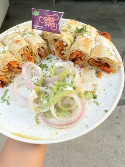 Another view of our popular Chaap Roll platter, a dish that's loved by everyone. It's a great way to enjoy the taste of our signature chaap in a convenient roll.