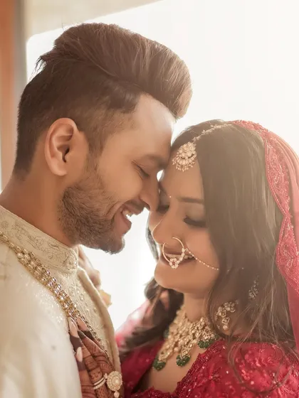 A romantic couple portrait that captures the joy of the wedding day. Her makeup is soft and radiant, designed to look beautiful in natural light and enhance her happy glow.