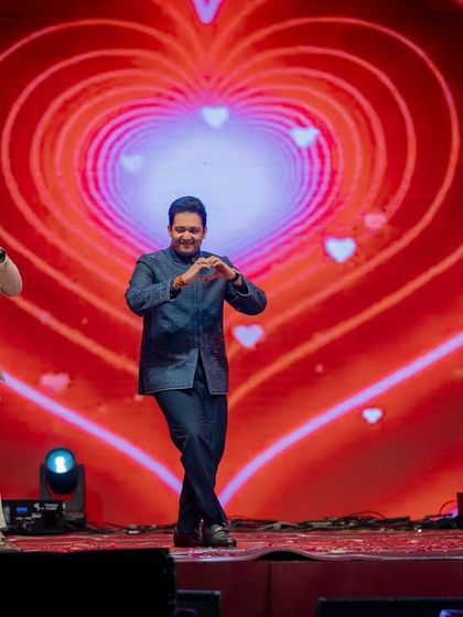 A fun and lighthearted performance by the groom's brothers, complete with heart-hand gestures and a romantic LED background.