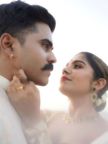 A beautiful couple shoot with influencers Jisma and Vimal. We handled the groom's makeup, creating a classic look with a sharp mustache.
