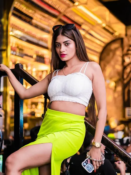 A guest in a neon green skirt, adding a pop of color to the night.