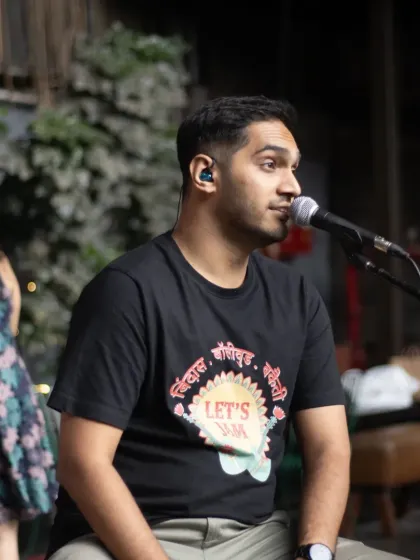 Our vocalist, Goutam, in his element during a soulful number. He's wearing our custom 'Let's Jam' merchandise, just like the rest of the team.