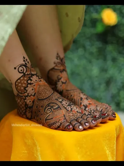 A lovely design for the feet, featuring a central paisley motif surrounded by intricate patterns. This style provides good coverage while remaining elegant.