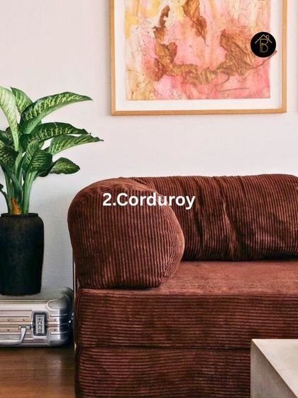 A brown corduroy sofa is a perfect example of using texture to make the color feel modern. The ribbed fabric adds depth and a tactile quality, making the furniture a cozy and stylish centerpiece.