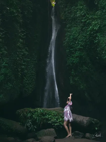 A moody and atmospheric shot at Leke Leke Waterfall. I love playing with natural light and shadows to create a sense of mystery and adventure in my solo travel portraits.