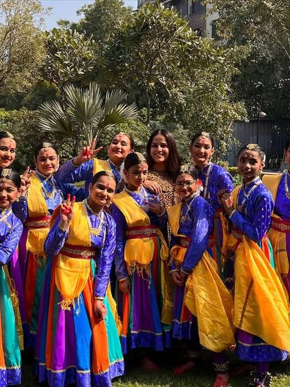 A happy moment with my wonderful students after a performance. Their smiles and victory signs say it all.