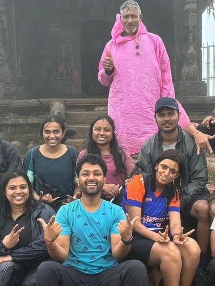 The crew at the Kodachadri peak, posing in front of the ancient temple structure. A moment of triumph and history combined.