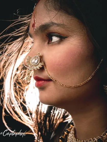 A detailed close-up from a traditional Indian fashion shoot. This image highlights my ability to capture the intricate beauty of ethnic jewellery and makeup, using focused lighting to make every detail shine.