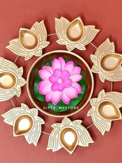 This beautiful lotus urli with a floating flower candle is another premium decorative item that can be added to your custom hamper. It's perfect for creating a serene, festive ambiance.