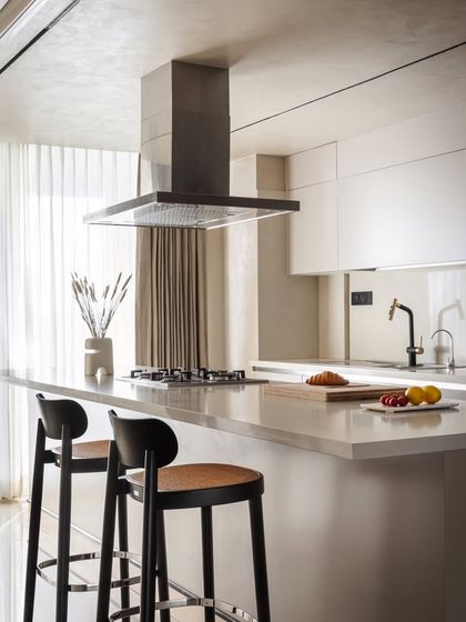 A closer look at the kitchen island reveals the clean lines and high-quality finishes. This space is designed to be both a functional cooking area and a social hub, reflecting the home's emphasis on effortless living and shared moments.