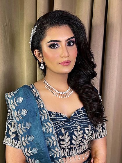 When the bride asks for full glam, we deliver. This look features glittery eyes to match her lehenga, and we're debating between matte and glossy lips. Which do you prefer?