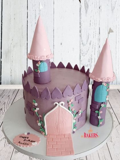 A gorgeous Princess Castle theme cake for a 5th birthday. I love making these minimal-fondant beauties, using buttercream for the cake and fondant only for the detailed towers and decorations.