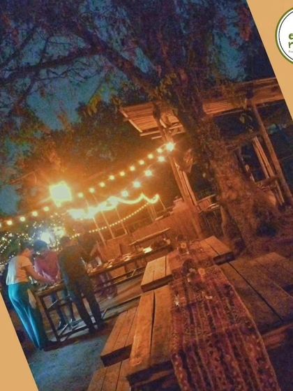 The rustic charm of our farm at dusk. Our open-air dining area is perfect for enjoying the cool evening breeze and a sky full of stars.