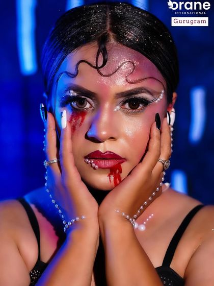 A powerful close up of the "evil lady" look, showcasing the use of graphic lines, blood effects, and contrasting textures.