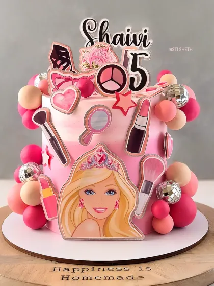 A fun and glamorous Barbie cake for a 5th birthday, featuring makeup and accessory toppers. This is my signature Mocha Orange flavour.