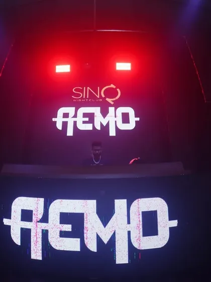 My custom logo lighting up the DJ booth at SinQ Nightclub in Goa. Branding the stage is part of creating a signature experience for the audience.