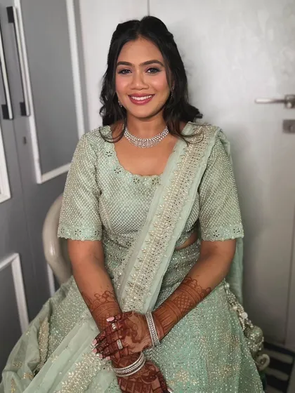 The final result of the soft glam makeover. The client looks radiant and confident, with makeup that enhances her beautiful smile.